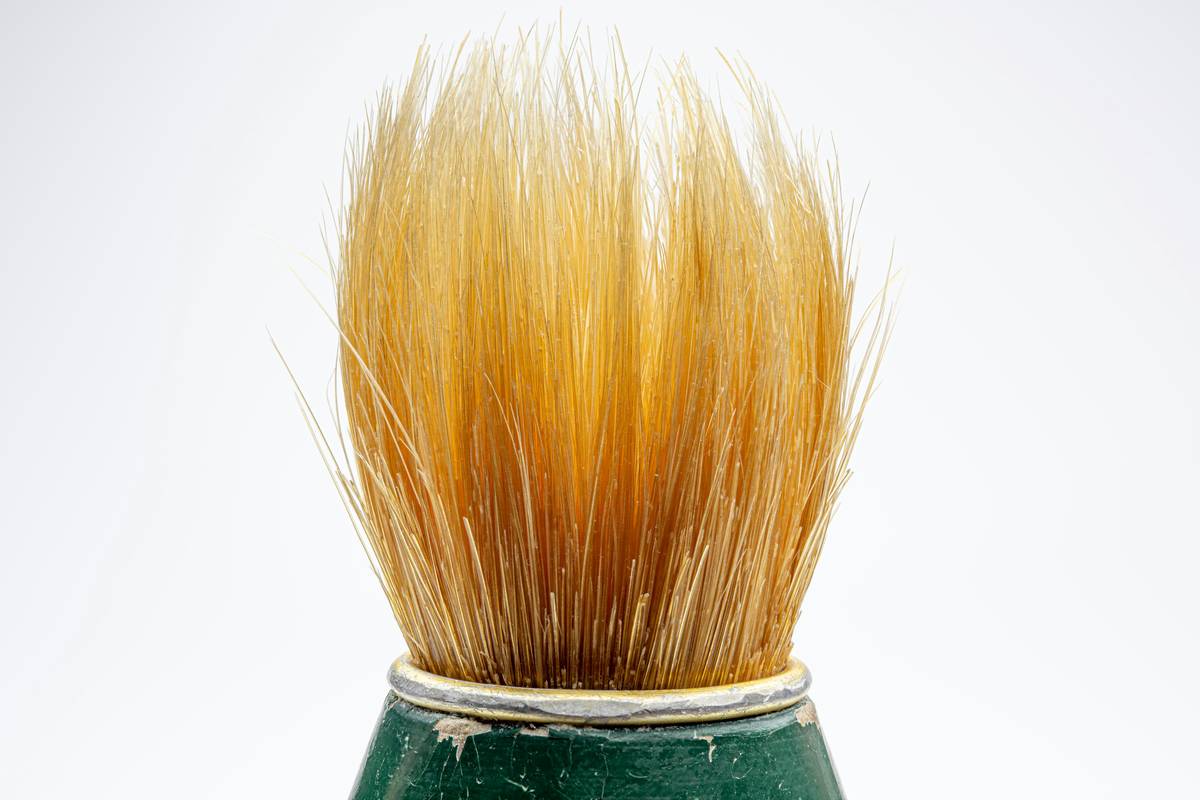 Close-up of high-quality brushes for dry brushing skin with natural boar bristles and ergonomic handle